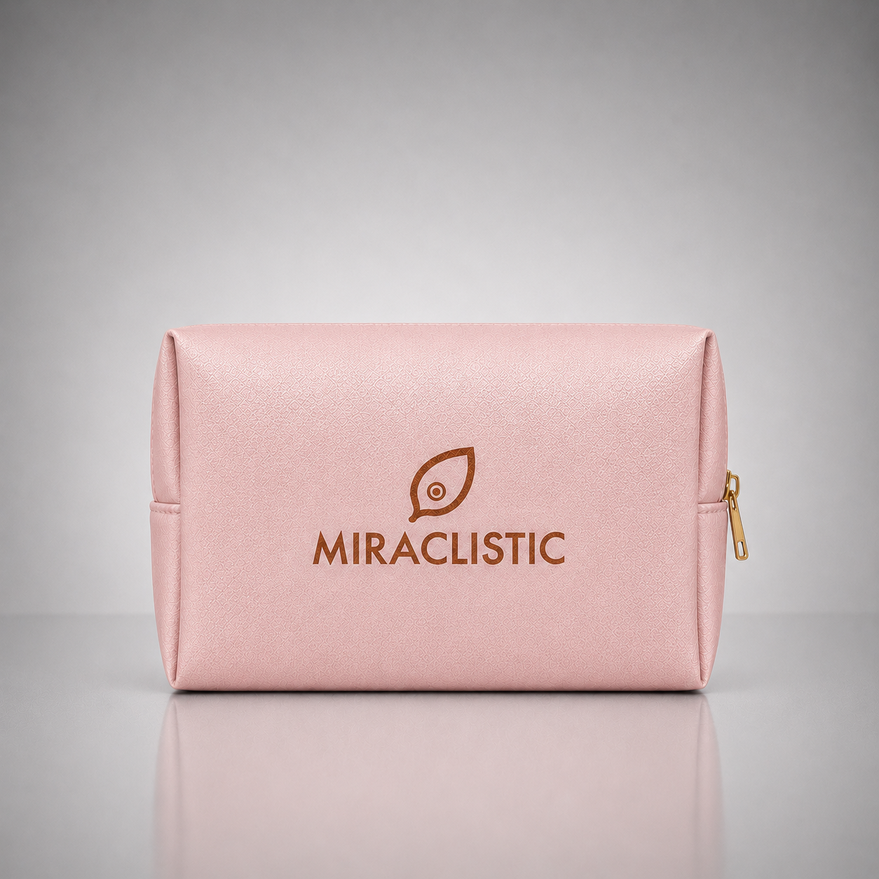 MIRACLISTIC blush pink personal car essential kit pouch on a grey background